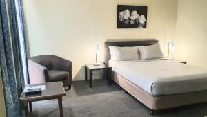 Postel nebo postele na pokoji v ubytování Hotel Cavalier