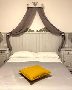 Rúm í herbergi á Enjoy Ledro B&B