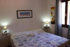 Кровать или кровати в номере Villa Lughente