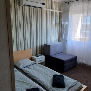 Posteľ alebo postele v izbe v ubytovaní ARANYHÍD APARTMAN + 30 fotografií