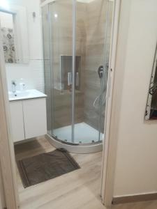 a shower with a glass door in a bathroom at Casetta Bevilacqua in Sciacca