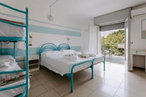 Postel nebo postele na pokoji v ubytování Hotel Edward