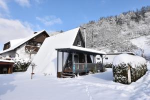 a house covered in snow in the snow at Ferienhaus Giebelei in Medebach