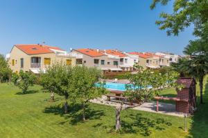 an aerial view of a house with a swimming pool at Maj Premium Residence in Poreč