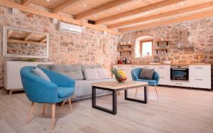 a living room with a couch and two chairs and a table at Luxury Rustic Villa Hvar island in Vrbanj