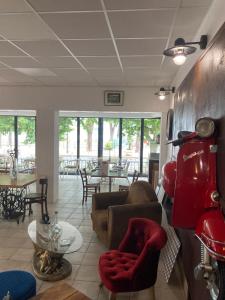 a living room with a couch and a table at Hotel de la plage in Banyuls-sur-Mer