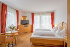 Voodi või voodid majutusasutuse Garni Hotel Am Meilenstein toas