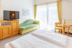 Voodi või voodid majutusasutuse Garni Hotel Am Meilenstein toas