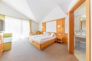 Voodi või voodid majutusasutuse Garni Hotel Am Meilenstein toas