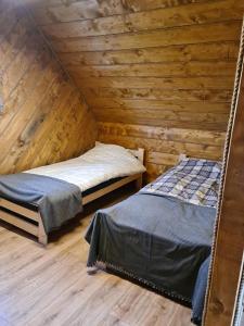 Postel nebo postele na pokoji v ubytování Łowisko Redyki