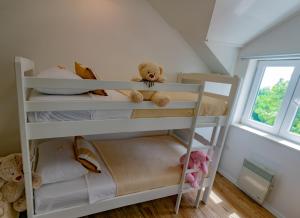 a white bunk bed in a room with a window at Villa Mara in Drniš +50 photos