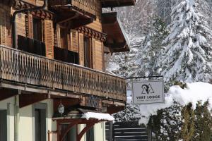 a sign for a ski lodge in the snow at Vert Lodge Chamonix in Chamonix-Mont-Blanc