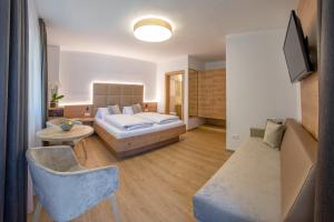 Voodi või voodid majutusasutuse Garni Hotel Am Meilenstein toas