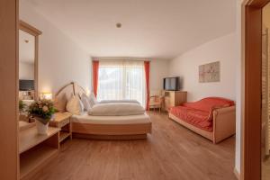 Voodi või voodid majutusasutuse Garni Hotel Am Meilenstein toas