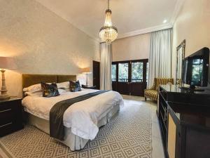 Ένα ή περισσότερα κρεβάτια σε δωμάτιο στο Coco De Mer Boutique Hotel