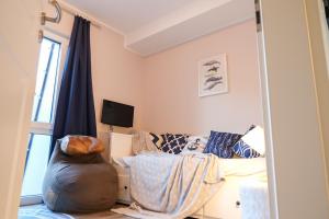TV a/nebo společenská místnost v ubytování Ferienwohnung Strandhoch
