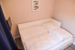 Postel nebo postele na pokoji v ubytování Ferienwohnung Strandhoch