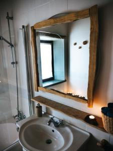 a bathroom with a sink and a mirror at Soul Farm Algarve - Glamping & Farm Houses in Aljezur
