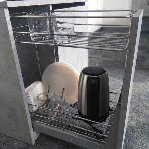 a black appliance is sitting in a refrigerator at Гостиница Газпром трансгаз Беларусь in Minsk