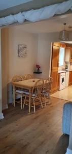 a kitchen and dining room with a table and chairs at Courthouse View in Carrick on Shannon