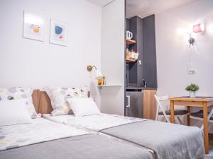 Postel nebo postele na pokoji v ubytování Pinna Apartments Hvar