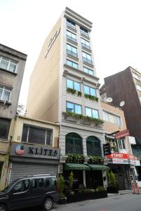 a minivan parked in front of a building at Ferman Apart Hotel in Istanbul