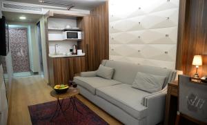 a living room with a couch and a table at Ferman Apart Hotel in Istanbul