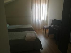 Posteľ alebo postele v izbe v ubytovaní Casa per Ferie Suore Domenicane + 11 fotografií
