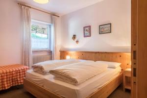 A bed or beds in a room at Casa Lorenz 2