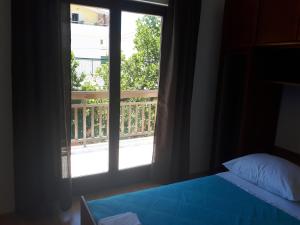 Postel nebo postele na pokoji v ubytování Apartman Emilio