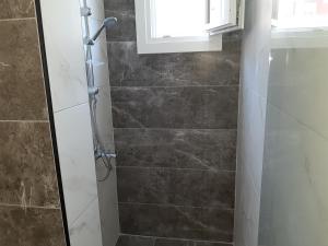 A bathroom at Villa Pappas Még 35 kép