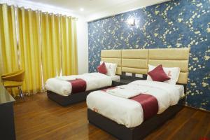 Voodi või voodid majutusasutuse Lime Tree Hotel Pulkit Gurgaon-Artemis Hospital, Nearest Metro Huda City Centre toas