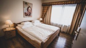A bed or beds in a room at Appartementhaus Am Gschwandtkopf