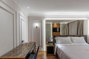 Postel nebo postele na pokoji v ubytování Giulia Albérgo Hotel