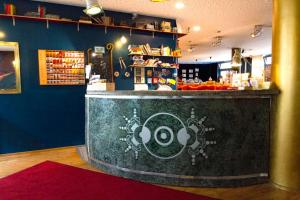 a bar in a restaurant with a counter at Heart of Gold Hostel Berlin in Berlin