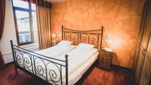 A bed or beds in a room at Appartementhaus Am Gschwandtkopf