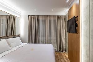 Postel nebo postele na pokoji v ubytování Giulia Albérgo Hotel