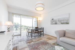 a living room with a couch and a table at La Vista in Cannes