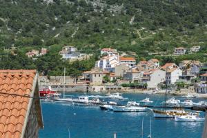 a group of boats are docked in a harbor at Apartment Eša in Komiža