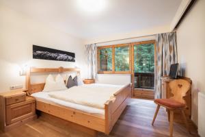 A bed or beds in a room at Appartements Hochlega