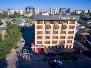 an overhead view of a hotel building in a city at Megapolis Hotel Shymkent in Shymkent