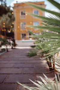 a brick walkway with a large building in the background at Hotel Serenity Platja d'Aro by Pandora Hoteles in Platja d'Aro +31 photos