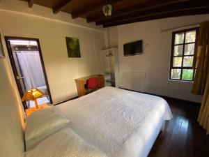 Letto o letti in una camera di Hostal Alcala