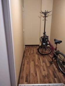 a bike parked in a room with a hallway at ТИХОТО МЯСТО in Burgas City