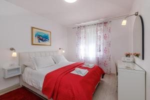 Postel nebo postele na pokoji v ubytování Apartments Lavizatic