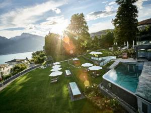an aerial view of a resort with a swimming pool at Belvédère Strandhotel in Spiez