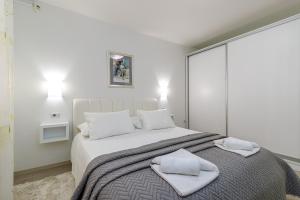 Postel nebo postele na pokoji v ubytování Apartments Lavizatic