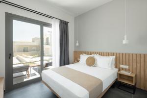 Postel nebo postele na pokoji v ubytování Yuka Villas Collection