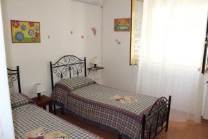 A bed or beds in a room at mare verde salento