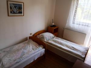Posteľ alebo postele v izbe v ubytovaní Penzión - Chata Fortuna